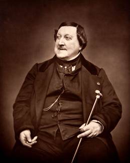 Quelle: Public domain Historische Fotografie des Komponisten Giacomo Rossini mit Gehstock und Zigarre in der Hand, bekleidet mit Anzug und Weste